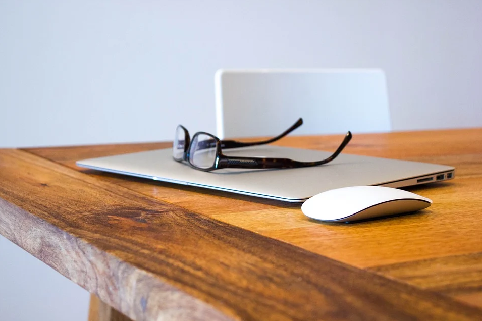 laptop and glasses on a table